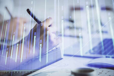 Double exposure of forex graph drawing over people taking notes background. Concept of financial analysisの写真素材