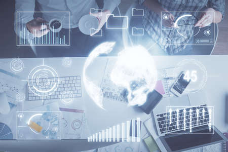 Double exposure of man and woman working together and financial chart hologram drawing. market...