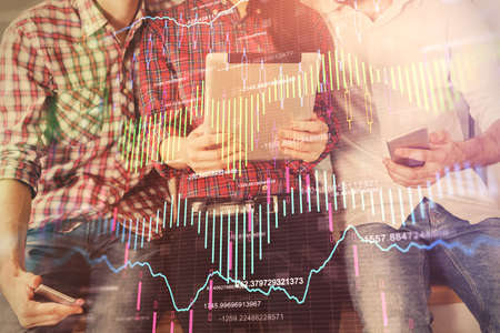 Double exposure of forex graph drawing and man and woman working together holding and using a mobile...