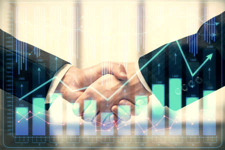 Double exposure of forex graph hologram and handshake of two men. Stock market concept.
