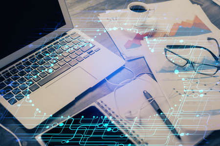 Double exposure of table with computer on background and data theme drawing. Concept of innovation.