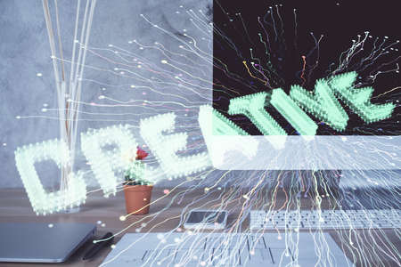 Desktop computer background in office and start up theme hologram drawing. Double exposure. Startup...