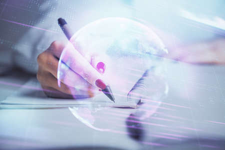 Technology theme hologram over womans hands taking notes background. Concept of Tech. Double exposureの写真素材