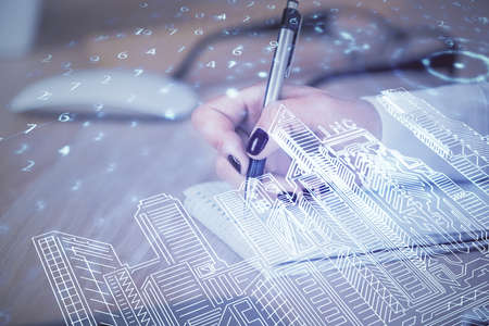 IOT drawing over writing hands in notepad background. Concept of smaert home. Multi exposureの写真素材