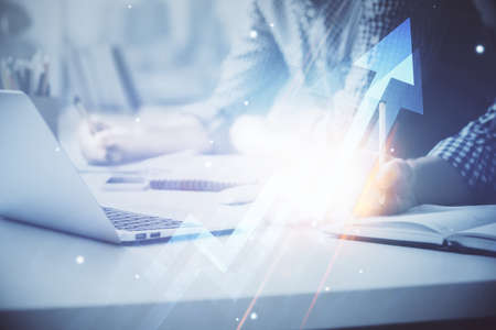 Growing arrows with businessman working on computer on background. Success concept. Double exposure.