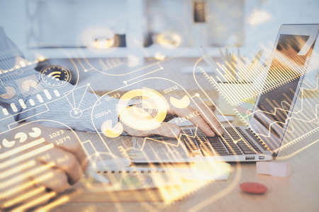 Technology theme hologram with man working on computer on background. High tech concept. Double...