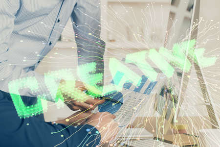 Start up drawings with businessman working on computer on background. Teamwork concept. Double...