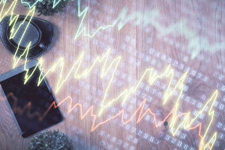 Multi exposure of financial chart hologram over desktop with phone. Top view. Mobile trade platform...