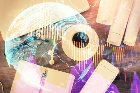 Multi exposure of forex graph drawing over desktop background with computer. Concept of financial...