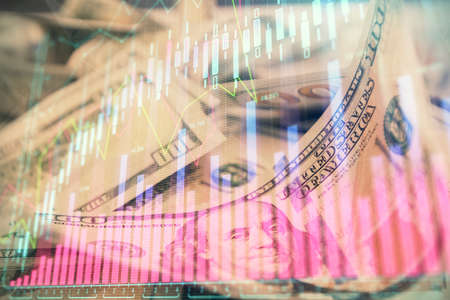Double exposure of forex graph drawing over us dollars bill background. Concept of financial markets.の写真素材