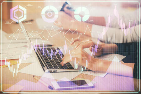 Multi exposure of woman hands typing on computer and financial chart hologram drawing. Stock market...