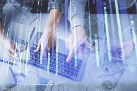 Double exposure of man and woman working together and forex graph hologram drawing. Financial...