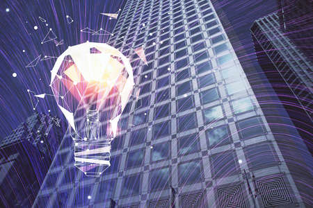 Multi exposure of bulb hologram drawing and cityscape background. Concept of idea.