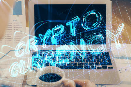 Double exposure of blockchain theme hologram and table with computer background. Concept of bitcoin...