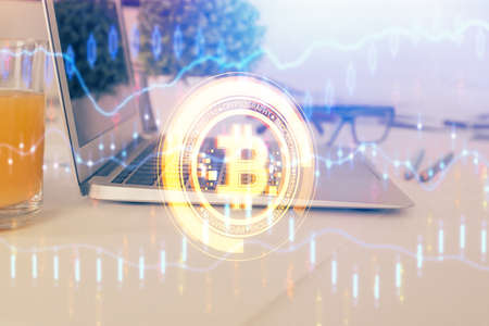 Double exposure of blockchain theme hologram and table with computer background. Concept of bitcoin...