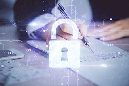 Double exposure of hands making notes with lock icons. Concept security and protection of data