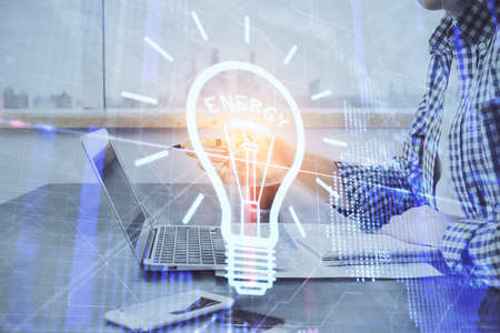 Growing arrows with businessman working on computer on background. Success concept. Double exposure.の写真素材
