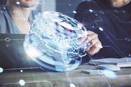 Multi exposure of data internet theme hologram with man working on computer on background. Concept...