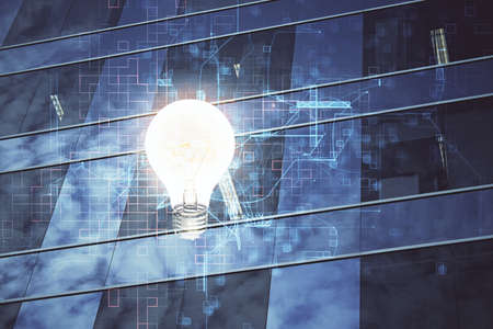 Multi exposure of bulb hologram drawing and cityscape background. Concept of idea.