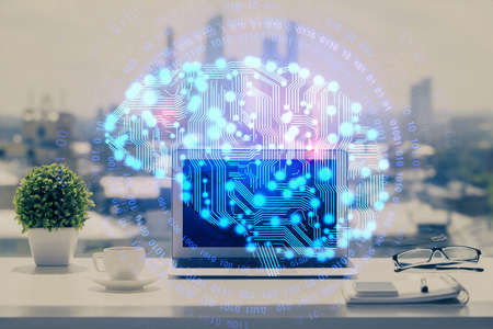 Double exposure of desktop with computer and brain drawing hologram. Artificial intelligence concept.の写真素材
