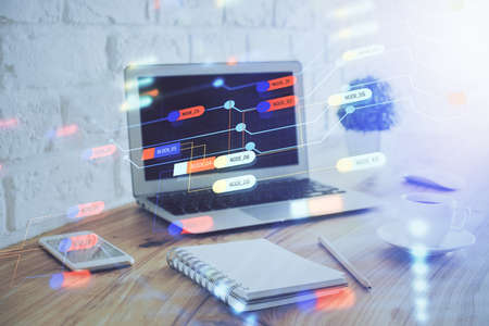 Double exposure of laptop computer and technology theme hologram. Concept of freelance work.の写真素材