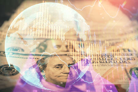 Double exposure of forex graph drawing over us dollars bill background. Concept of financial markets.の写真素材