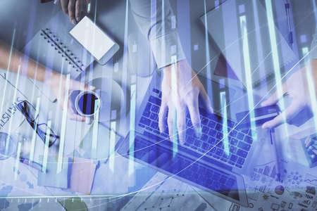 Double exposure of man and woman working together and forex graph hologram drawing. Financial...