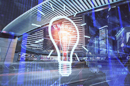 Multi exposure of bulb hologram drawing and cityscape background. Concept of idea.の写真素材