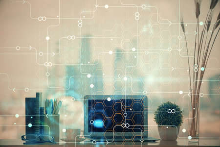 Double exposure of table with computer on background and data theme hologram. Data technology...