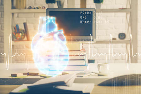 Desktop computer background and heart drawing. Double exposure. Medical study and healthcare concept.の写真素材