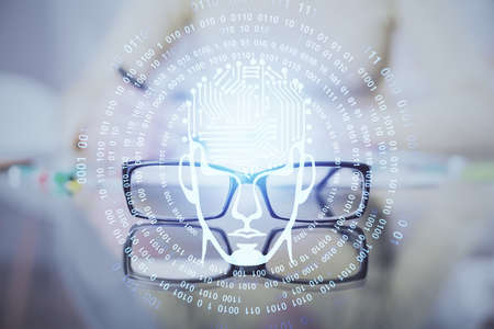 Double exposure of writing hand on background with brain hologram. Concept of learning.