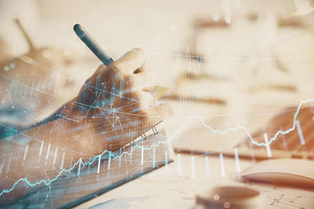 Double exposure of forex chart drawing over people taking notes background. Concept of financial...