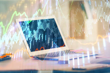 Forex Chart hologram on table with computer background. Double exposure. Concept of financial...