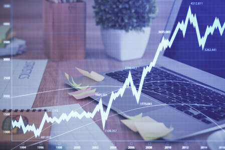 Multi exposure of forex graph and work space with computer. Concept of international online trading.の写真素材