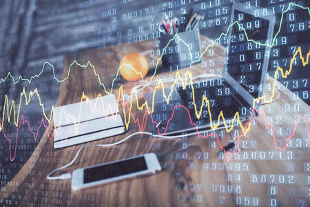 Forex market graph hologram and personal computer on background. Multi exposure. Concept of...
