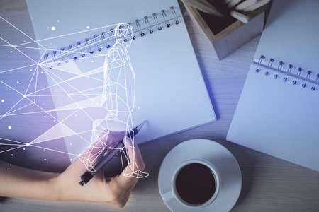 Start up creative drawing over close up hands in notepad background. Concept of brainstorming....