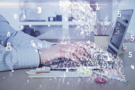 Technology theme hologram with man working on computer on background. High tech concept. Double exposure.の写真素材