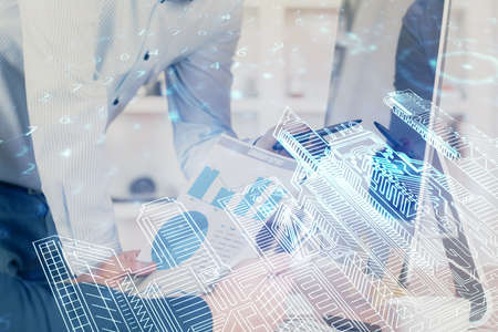 High tech city drawing with businessman working on computer on background. Smartcity concept. Double exposure.の写真素材