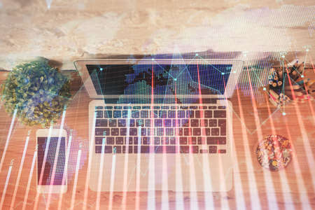 Multi exposure of financial chart drawing over table background with computer. Concept of research....