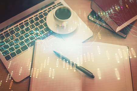 Stock market graph and top view computer on the table background. Multi exposure. Concept of...