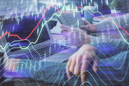 Double exposure of man and woman working together and forex chart hologram. Business concept....