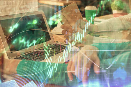 Double exposure of man and woman working together and forex chart hologram. Business concept....