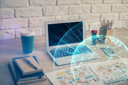 Computer on desktop with social network hologram. Multi exposure. Concept of international people...