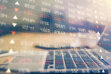 Financial graph colorful drawing and table with computer on background. Multi exposure. Concept of...