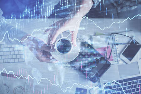 Double exposure of man and woman working together and financial chart hologram drawing. market...