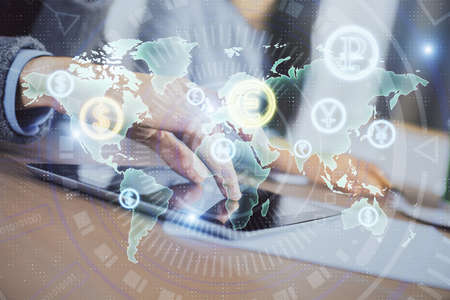 Double exposure of forex graph drawing and man and woman working together holding and using a mobile...
