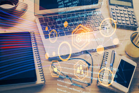 Double exposure of table with computer on background and data theme drawing. Concept of innovation.