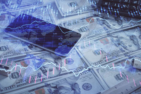 Double exposure of forex graph drawing over us dollars bill background. Concept of financial...