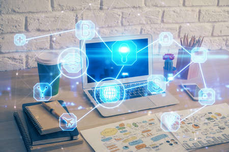 Computer on desktop with social network hologram. Multi exposure. Concept of international people connections.の写真素材