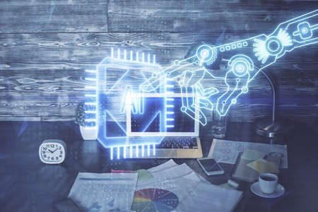 Double exposure of laptop computer and technology theme hologram. Concept of freelance work.